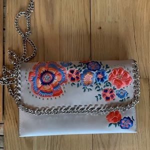 Top shop floral clutch with strap